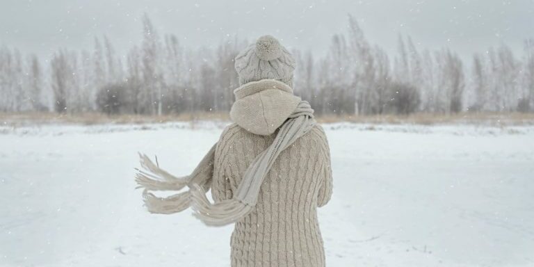 35570-womanstandinginsnow-snow-winter.1200w.tn