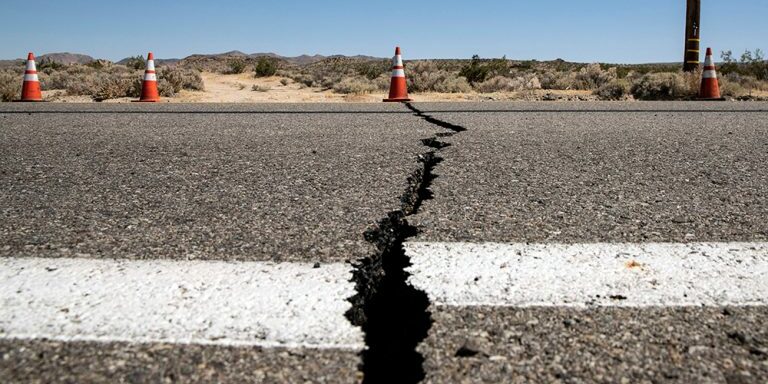 Mandatory Credit: Photo by ETIENNE LAURENT/EPA-EFE/Shutterstock (10328201b)
A cone indicates the localization of a crack in the road after an earthquake near Ridgecrest shook Southern California, USA, 04 July 2019. Earlier on the same day, a magnitude 6.4 earthquake shook Southern California. It's epicenter is located 150 miles north of Los Angeles near the cities of Ridgecrest and Trona.
Earthquake aftermath in Ridgecrest, California, USA - 04 Jul 2019