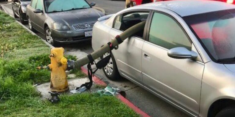 hose-sticking-out-of-car-window
