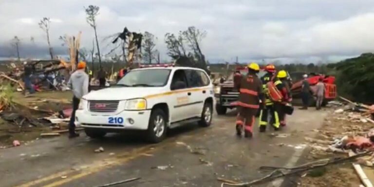 Emergency responders work in the scene amid debris in Lee County, Ala., after what appeared to be a tornado struck in the area Sunday, March 3, 2019. Severe storms destroyed mobile homes, snapped trees and left a trail of destruction amid weather warnings extending into Georgia, Florida and South Carolina, authorities said. (WKRG-TV via AP)