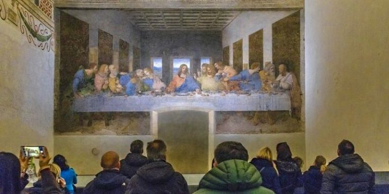 MILAN, ITALY, JANUARY - 2018 - People watching Leonardo da Vinci most famous last dinner painting located at santa maria delle grazie church in milan city.